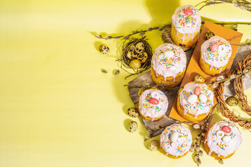 Traditional Easter cake. Festive sweet food with icing and decor. Eggs, nest, willow