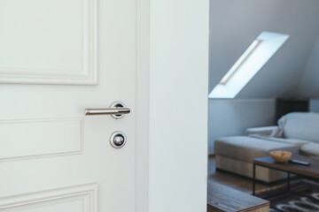 Hotel apartment door, white wooden doorway with metal handle