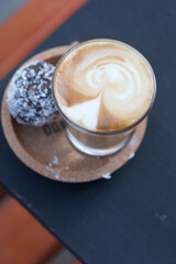 cup of coffee served with a cake ball