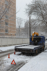 Moscow, Russia - April 04, 2022: Broken tow truck stands on the side of the road