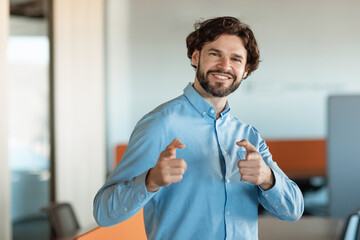 Obraz premium Portrait of smiling business man posing looking at camera