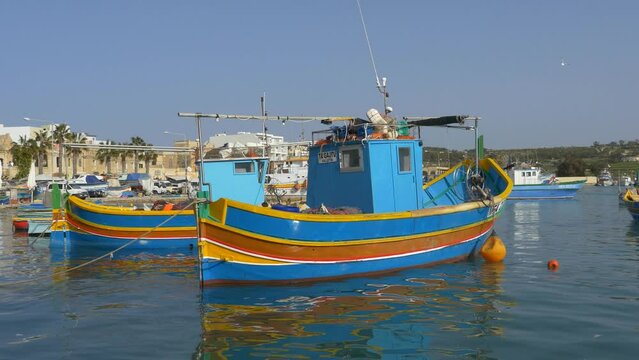 brightly painted boats in Marsaxlokk, Malta