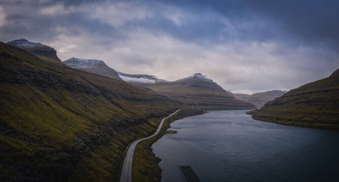 Faroe Islands, Eysturoy Island around Elduvik near Vesturdalsa. Dramatic weather, november 2021. Aerial panoramic drone view.