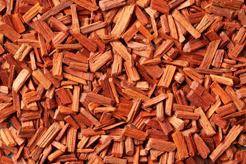Red sandal wood background, top view