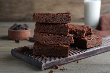 Delicious chocolate brownies on wooden table. Tasty dessert