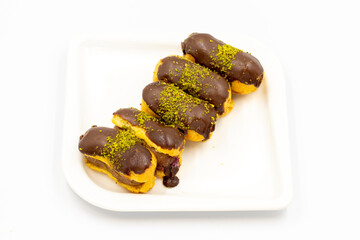 Chocolate eclair cake isolated on white background. Close-up.