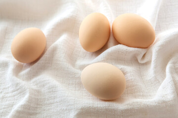 Chicken eggs on white background, selective focus. Happy easter background.