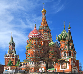 Fototapeta na wymiar Cathedral of Vasily Blessed, known as Cathedral of Intercession of Most Holy Theotokos on Moat, and Spasskaya Tower in spring. Moscow, Russia