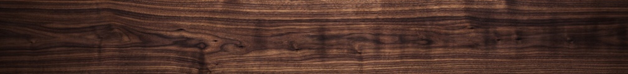 Fototapeta na wymiar Walnut wood texture. Super long walnut planks texture background.Texture element 