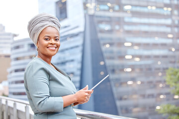 I can work from out here. Shot of a mature businesswoman using a digital tablet against a city...
