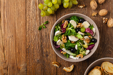 Italian spring salad with goat cheese, grapes and walnuts. Served with croutons.