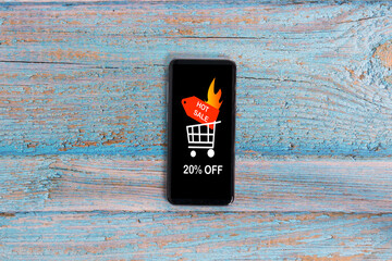 Smartphone that on its screen announces a discount of 20 percent for the hot sale.