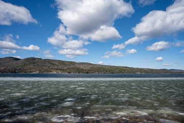 Fototapeta na wymiar ce on the edge of Lake Champlain on a beautiful winter day.