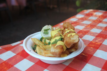 Grilled fish served with fries 