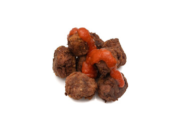 Fried meatballs covered with tomato sauce, isolated on white background.