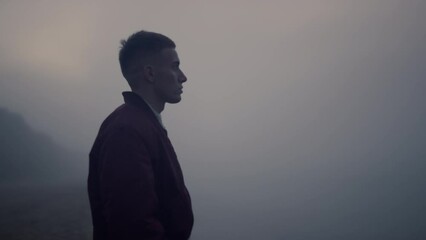 Upset guy walking on sea beach at sunrise. Exhausted man screaming outdoors - Powered by Adobe