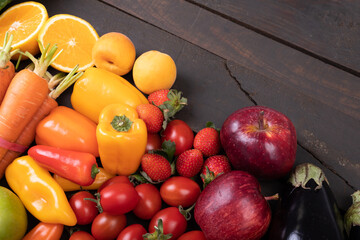 High angle view of various fresh organic fruits and vegetables on table, copy space