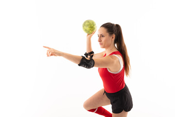 Caucasian young female player with arm outstretched and handball against white background