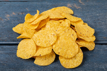 Close-up of crunchy chips on wooden table