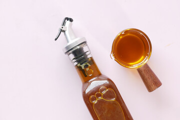 Mustard Seed Oil in a glass jar on table 