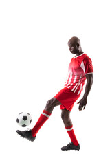 African american young male soccer player juggling ball on leg against white background
