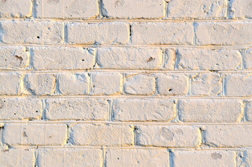 Old white brick wall. Ancient stone texture background. Urban background, white ruined industrial brick wall with copy space. Home and office design backdrop. Vintage effect. 