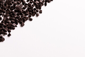 Directly above view of copy space by fresh chocolate chips over white background