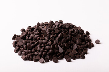 High angle view of fresh chocolate chips pile on white background