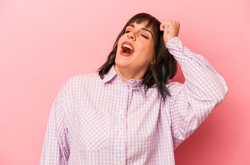 Young caucasian woman isolated on pink background celebrating a victory, passion and enthusiasm, happy expression.