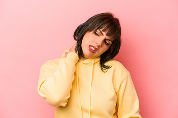 Young caucasian woman isolated on pink background suffering neck pain due to sedentary lifestyle.