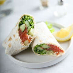Healthy salmon wrap with fresh salad