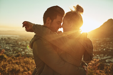 Lets run away and explore the world together. Cropped shot of an affectionate couple standing on a...