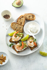 Roasted shrimps with cream cheese on toast