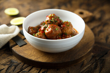 Homemade meatballs with tomato sauce and chili