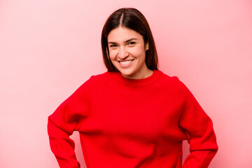 Young caucasian woman isolated on pink background happy, smiling and cheerful.