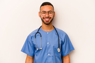 Young hispanic nurse man isolated on white background happy, smiling and cheerful.