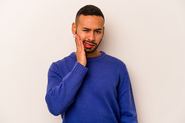 Young hispanic man isolated on white background having a strong teeth pain, molar ache.