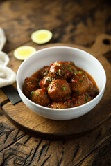 Homemade meatballs with tomato sauce and chili