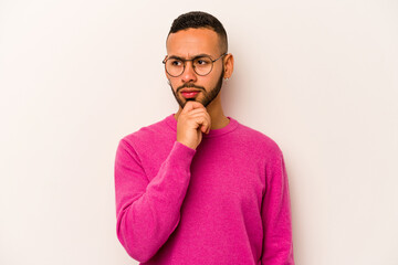 Young hispanic man isolated on white background suffers pain in throat due a virus or infection.