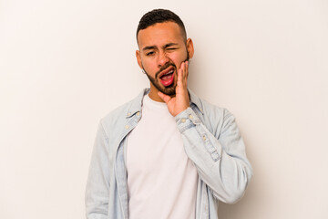 Young hispanic man isolated on white background having a strong teeth pain, molar ache.