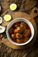 Homemade meatballs with tomato sauce and chili