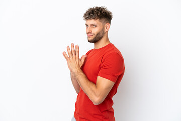 Young caucasian handsome man isolated on white background scheming something