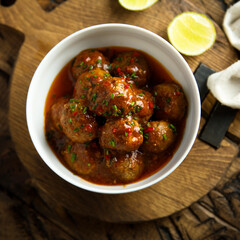Homemade meatballs with tomato sauce and chili