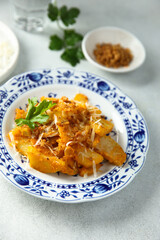 Roasted potato with red pesto and cheese