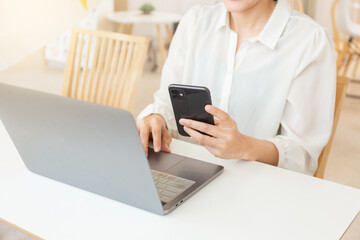 woman work using texting cell phone typing computer.student study education online learning.adult professional chatting on laptop,mobile contact us at Thinking business plan.connecting people concept