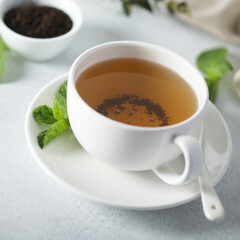 Healthy homemade mint tea in a white cup