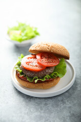 Traditional homemade burger with fresh tomato