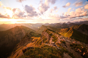 Sunrise morning sun lights on top of Bavarian Mountains