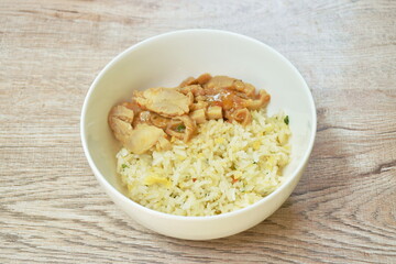 fried rice with egg topping chicken in Korean sauce on bowl
