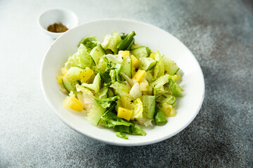 Leaf salad with cucumber and pineapple